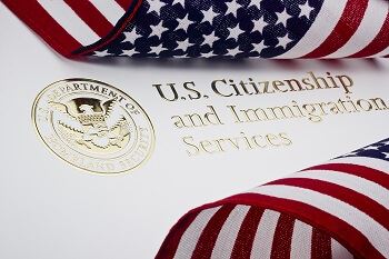 US Citizenship Services Paperwork and American Flag